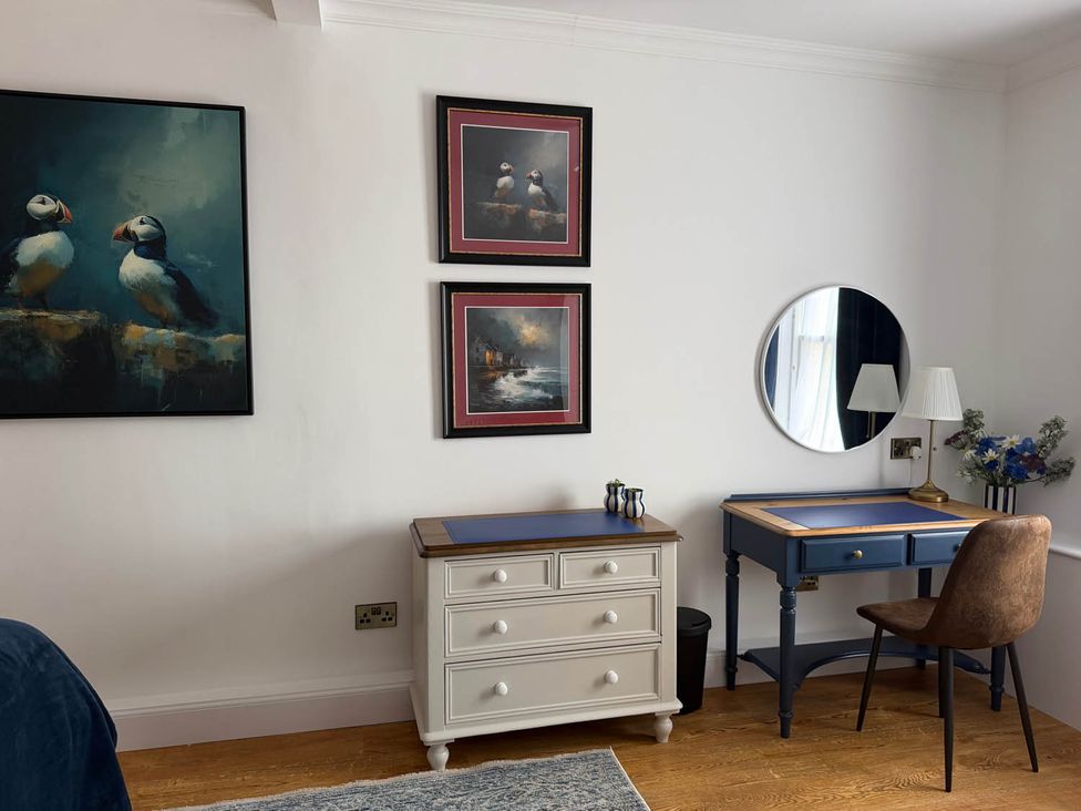 A home office with a desk and chair at 