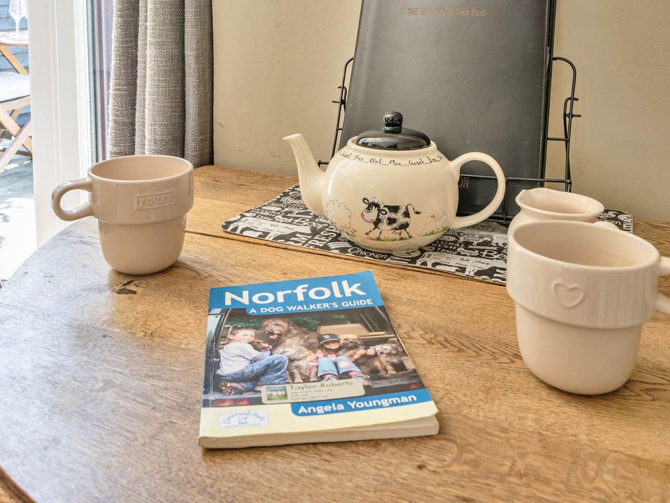A table with a teapot and mugs at Hayloft Sleeps 3 with Enclosed terrace Dereham