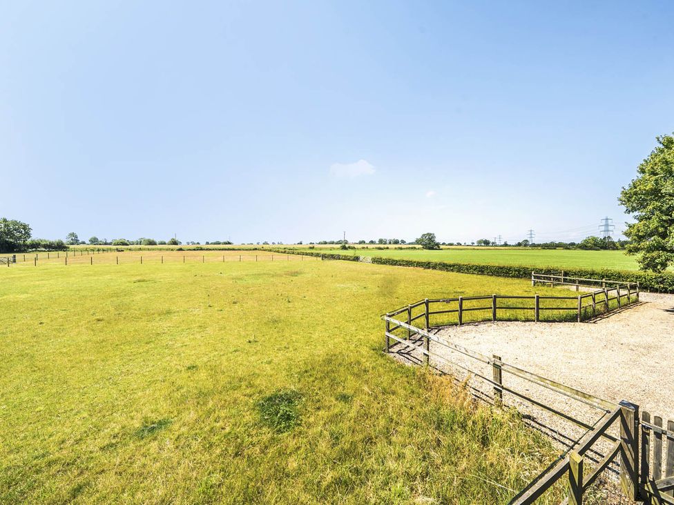 An open field with a fenced area at Hayloft Sleeps 3 with Enclosed terrace Dereham