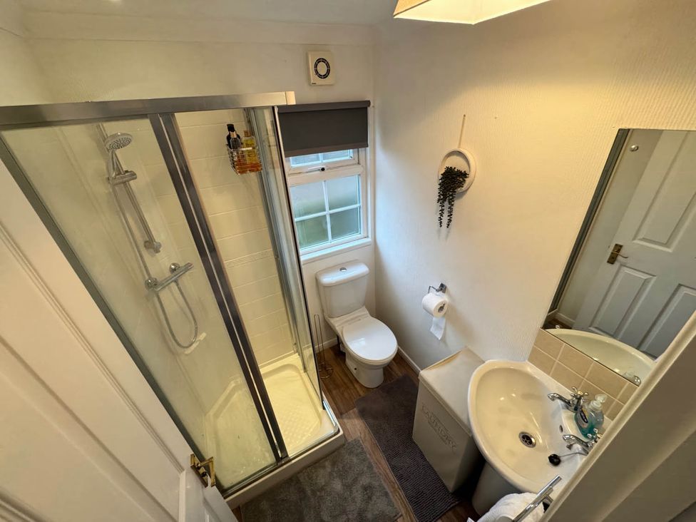 A bathroom with shower, toilet, and sink at Paddock View Snetterton Norfolk near East Harling
