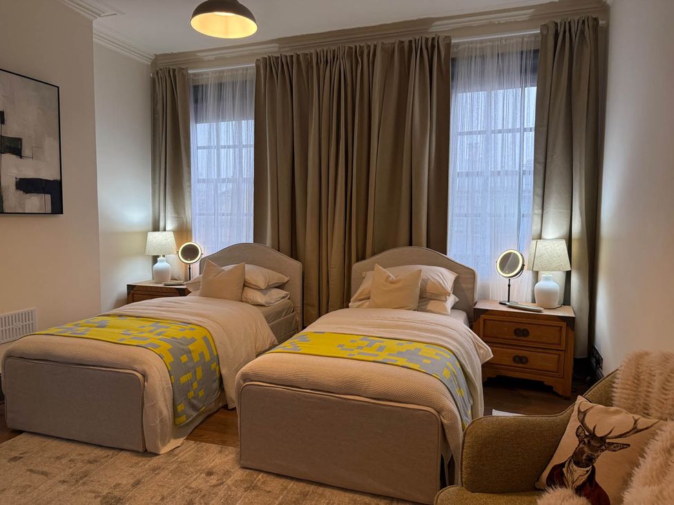 A bedroom with two beds and nightstands at 3 Bedrooms in Central Tunbridge Wells