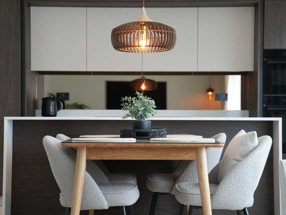 A kitchen with a table and chairs at 1st Floor Luxury 2Bed Apt Sleeps 6 St Andrews