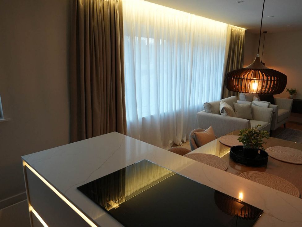 A living room with curtains and a sofa at 1st Floor Luxury 2Bed Apt Sleeps 6 St Andrews