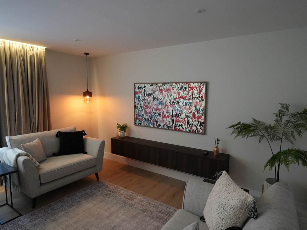 A living room with a sofa and artwork on the wall at 1st Floor Luxury 2Bed Apt Sleeps 6 St Andrews