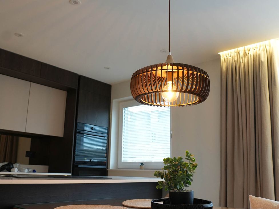A kitchen with a light fixture and a plant at 1st Floor Luxury 2Bed Apt Sleeps 6 in St Andrews