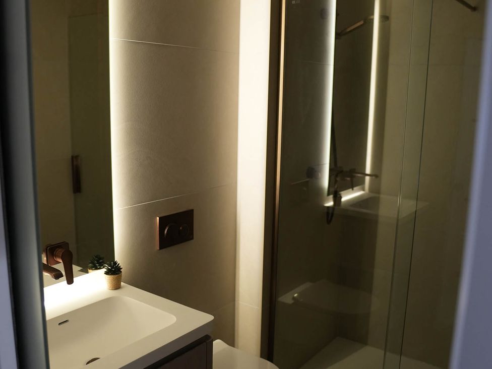 A bathroom with a sink, toilet, and shower at 1st Floor Luxury 2Bed Apt Sleeps 6 St Andrews
