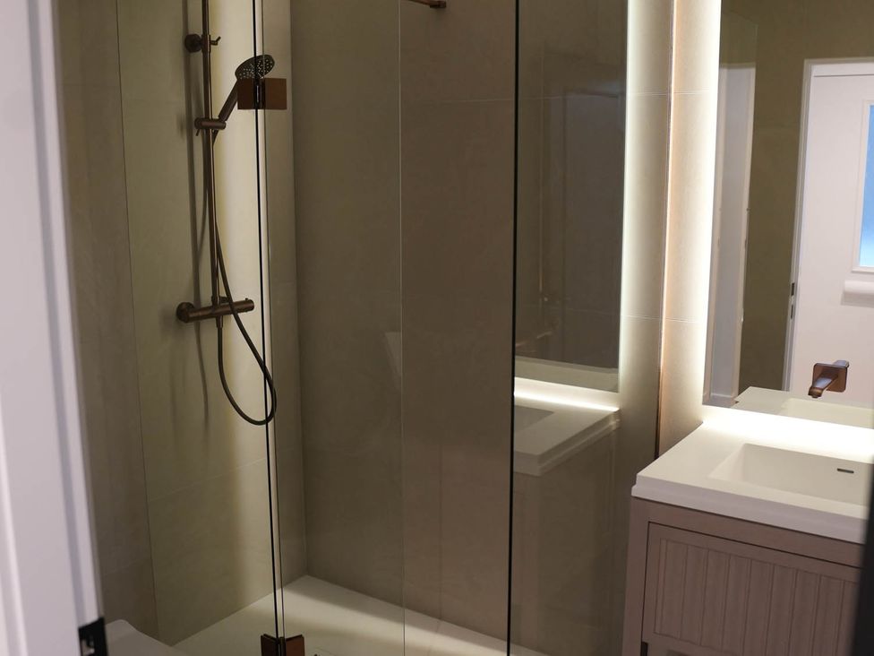 A bathroom with a shower and a sink at 1st Floor Luxury 2Bed Apt Sleeps 6 St Andrews