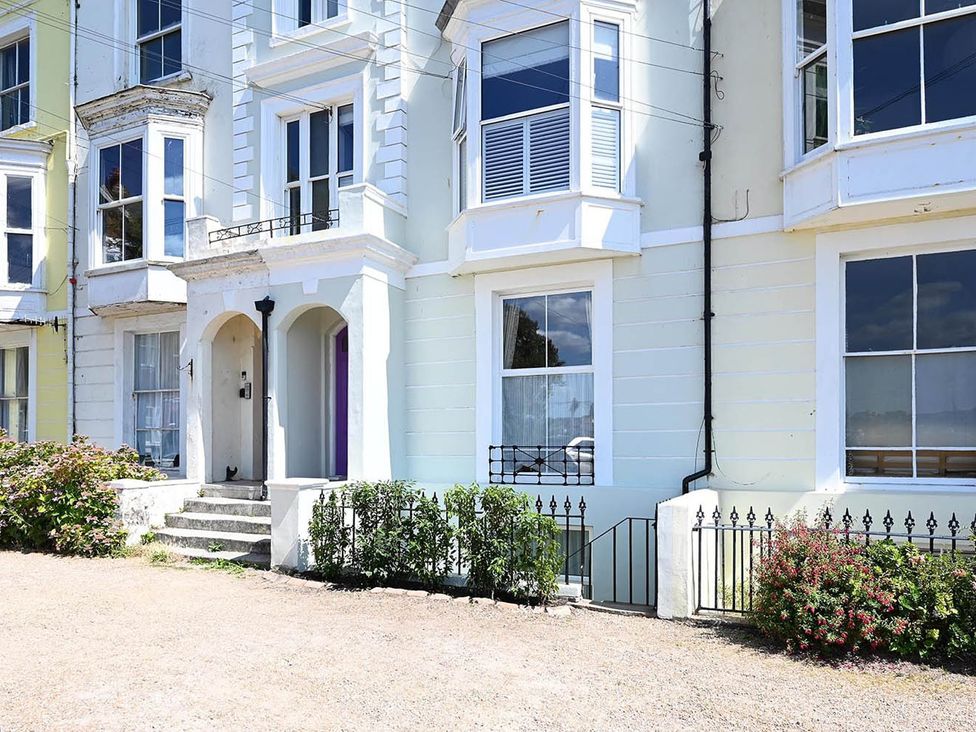 A house exterior with windows and front door at 1 Bed Sleeps 2 Near Beach Parking Hastings