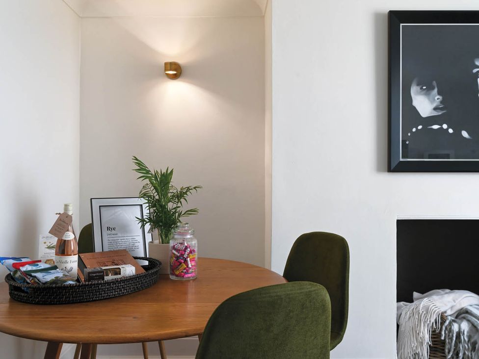 A dining room with a table and chairs at 1 Bed Sleeps 2 Near Beach Parking in Hastings