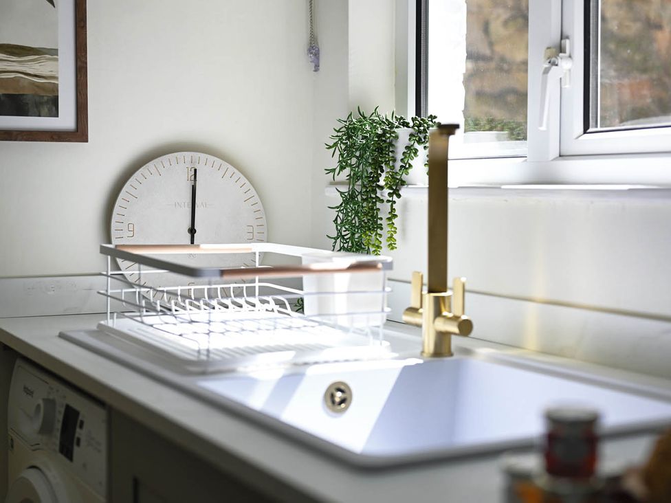 A kitchen with a sink and dish rack at 1 Bed Sleeps 2 Near Beach Parking Hastings