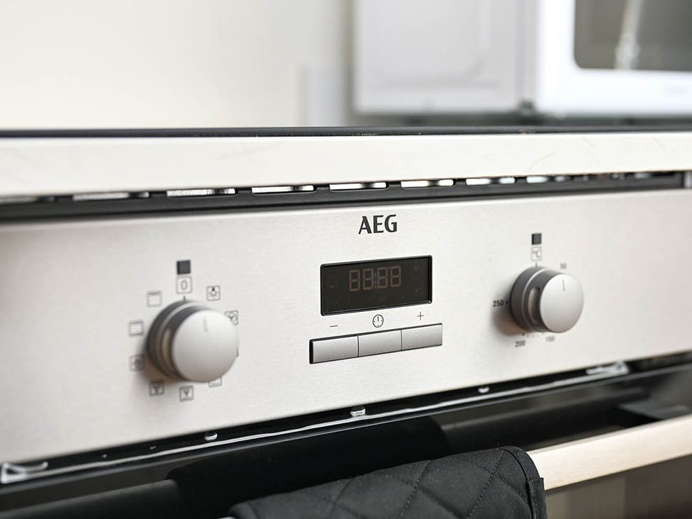 An AEG oven control panel in a kitchen at 1 Bed Sleeps 2 Near Beach Parking Hastings