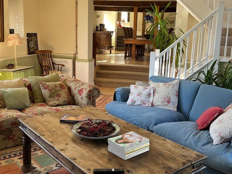 A living room with two sofas and a coffee table at The Hills Farmhouse 6 Bed Sleeps 11 Pets, Llanfilo near Talgarth