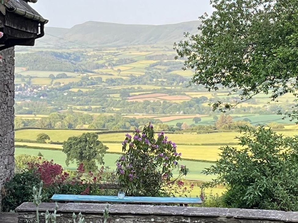 A view showing mountains and fields at The Hills Farmhouse 6 Bed Sleeps 11 Pets Llanfilo near Talgarth