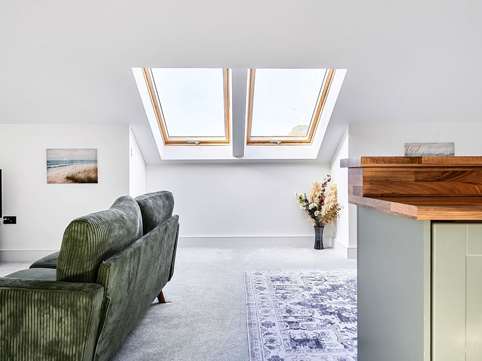 A living room with a sofa and television at Apartment Sleeps 4 with Balcony and Parking in Kingsbridge