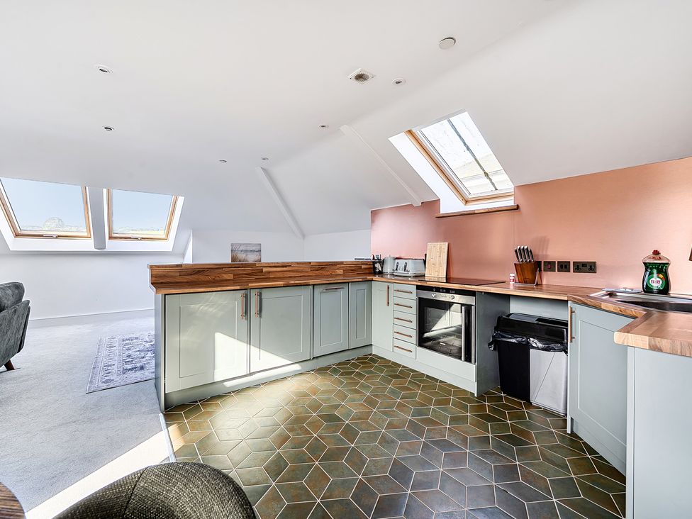 A kitchen with countertops and cabinets at Apartment Sleeps 4 with Balcony and Parking in Kingsbridge