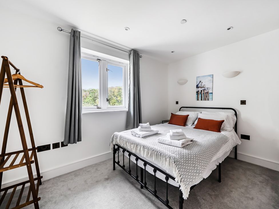 A bedroom with a bed and window at Apartment Sleeps 4 with Balcony and Parking in Kingsbridge
