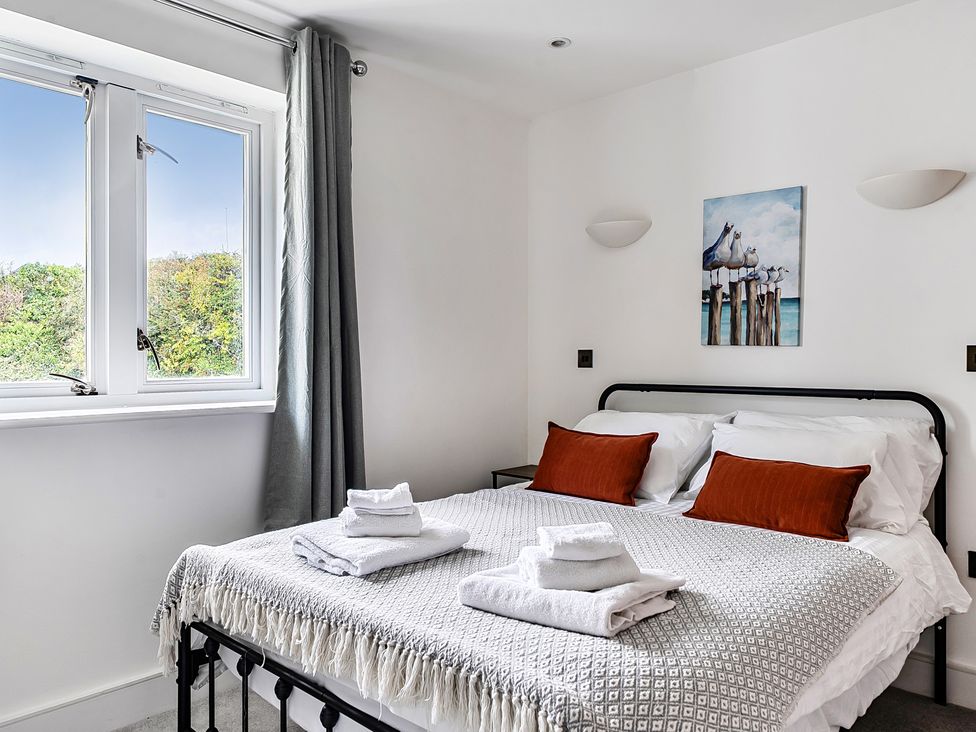 A bedroom with a bed and window at Apartment Sleeps 4 with Balcony and Parking in Kingsbridge