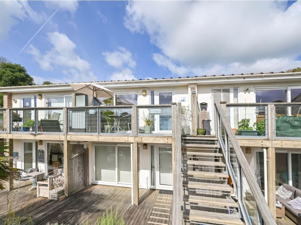 An outdoor area with stairs and a balcony at Torpoint Apartment Sleeps4 Seaside Parking Downderry