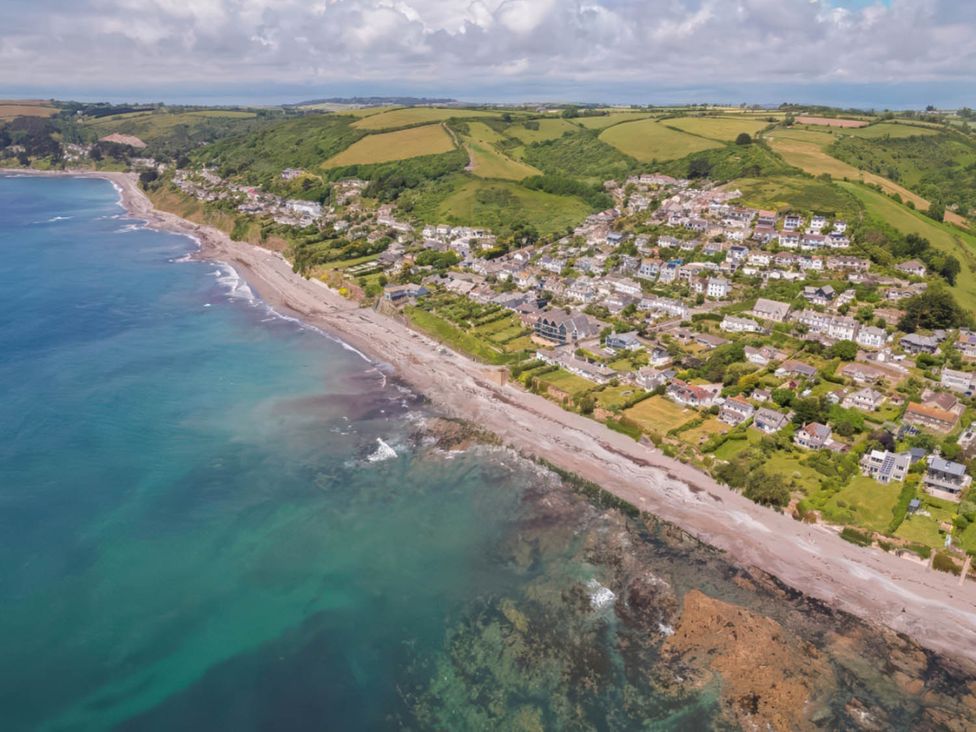 A coastal view with houses and beach at Torpoint Apartment Sleeps4 Seaside Parking in Downderry