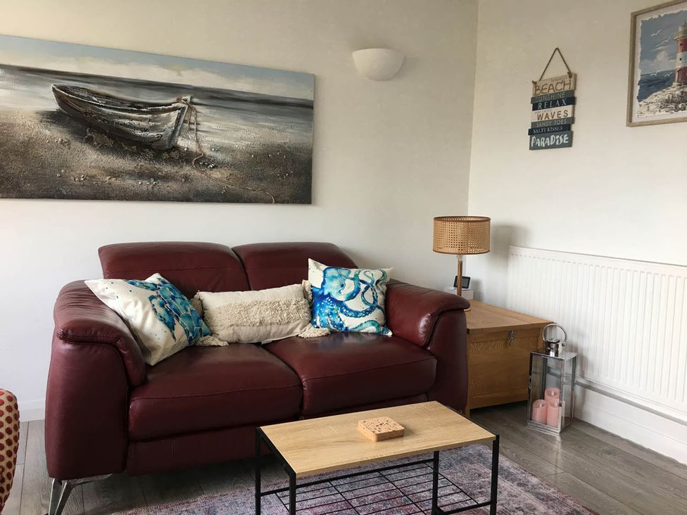 A living room with a sofa and coffee table at Torpoint Apartment Sleeps4 Seaside Parking in Downderry