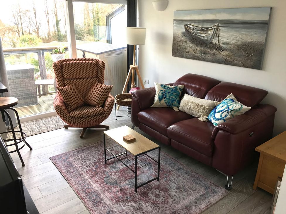 A living room with a sofa and armchair at Torpoint Apartment Sleeps4 Seaside Parking Downderry