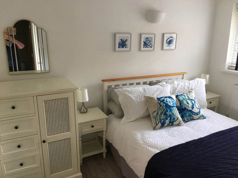 A bedroom with a bed and furniture at Torpoint Apartment Sleeps4 Seaside Parking Downderry