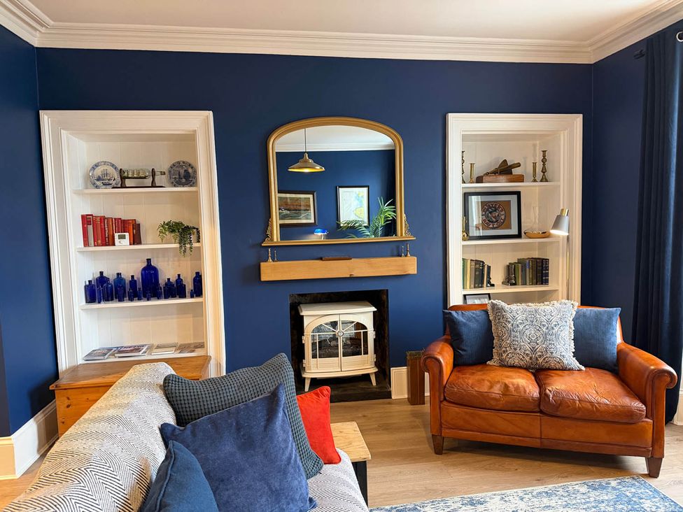 A living room with a sofa and coffee table at Seaview Apartment 2Bed on Anstruther Harbour in Anstruther