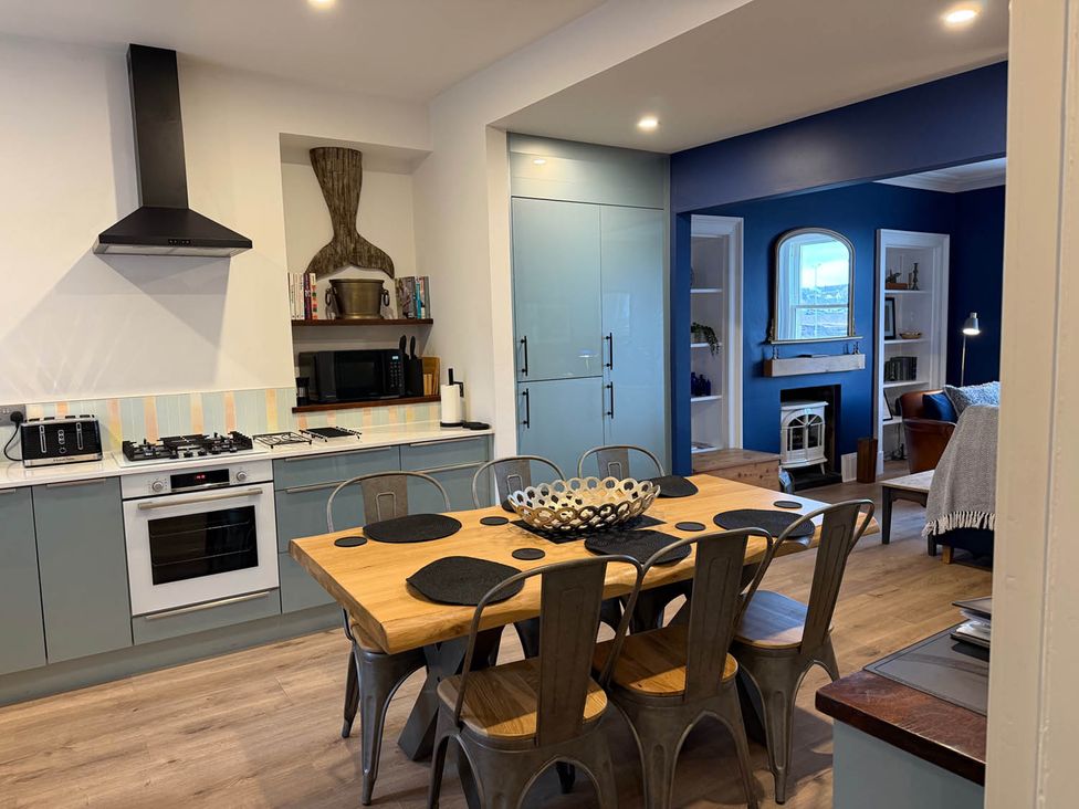 A kitchen with a dining table and chairs at Seaview Apartment 2Bed on Anstruther Harbour