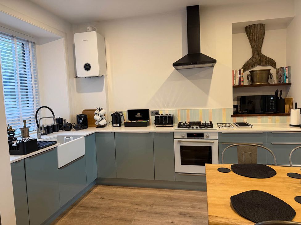 A kitchen with a sink and appliances at Seaview Apartment 2Bed on Anstruther Harbour, Anstruther