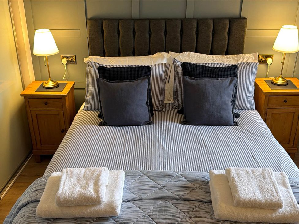 A bedroom with a bed and nightstands at Seaview Apartment 2Bed on Anstruther Harbour, Anstruther