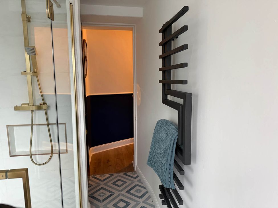A bathroom with a shower and towel warmer at Seaview Apartment 2Bed on Anstruther Harbour in Anstruther