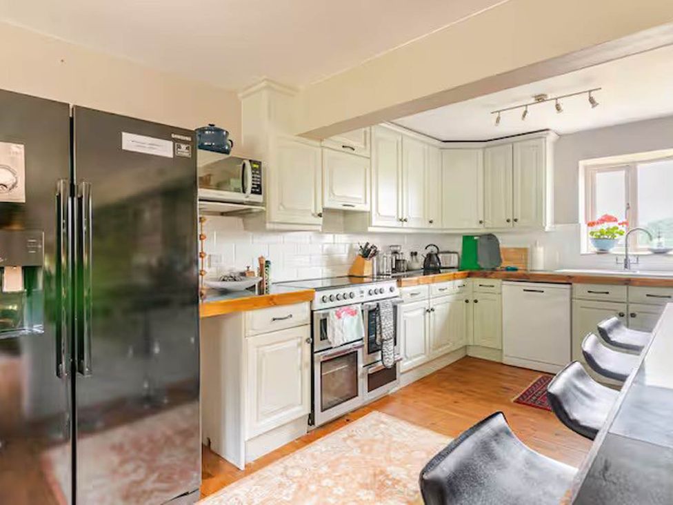 A kitchen with appliances and countertop space at Dowgill 3Bed Barn Sleeps 7 Hot Tub Parking Near Summerbridge