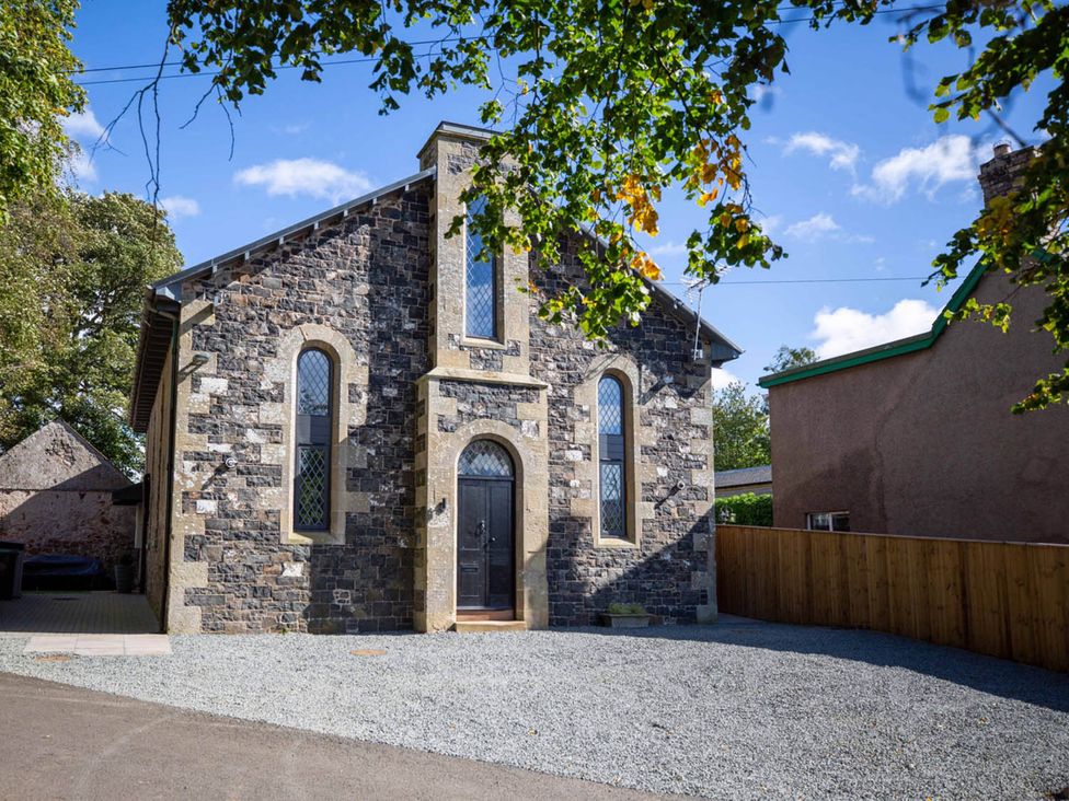 A stone building with windows and door at Stunning 3 Bed Converted Village Hall Near Kelso in Nenthorn near Kelso