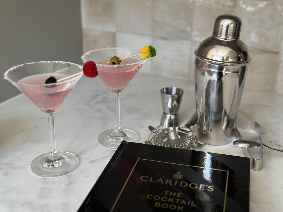 Two cocktails and a cocktail shaker at Claridge's The Cocktail Book
