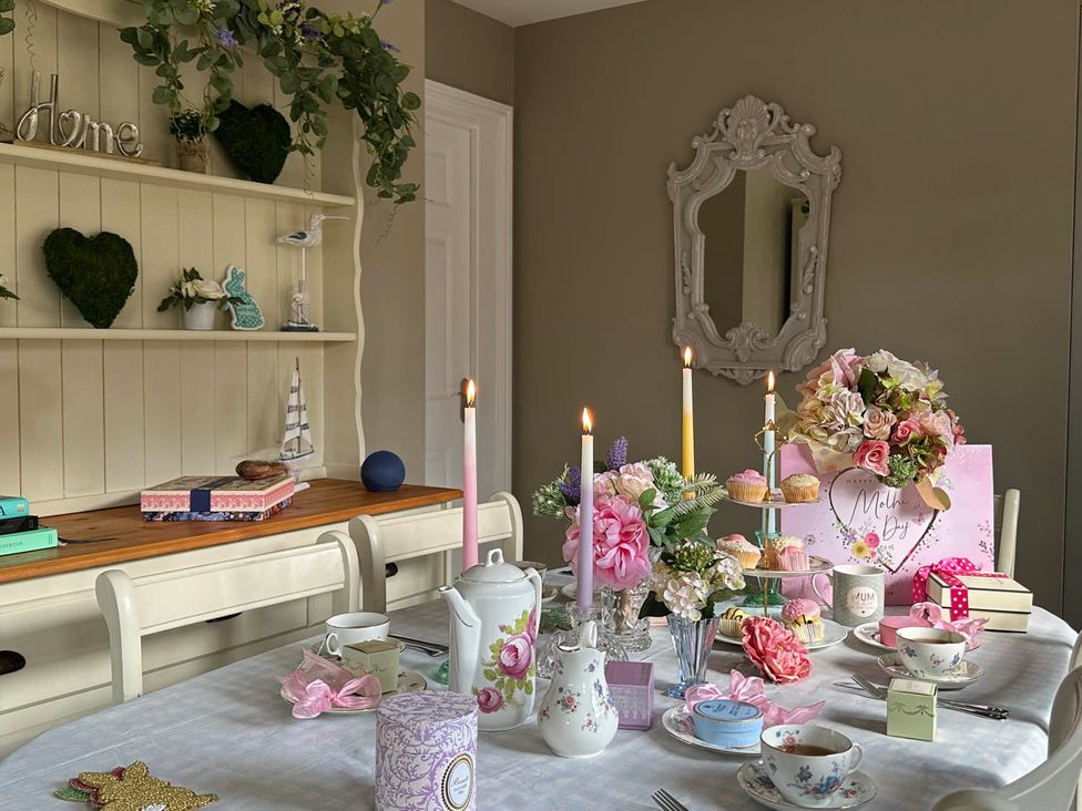 A dining room with a table set for tea at Cottage Sleep 4 Pet Friendly Enclosed Garden, Rollesby, near Scratby