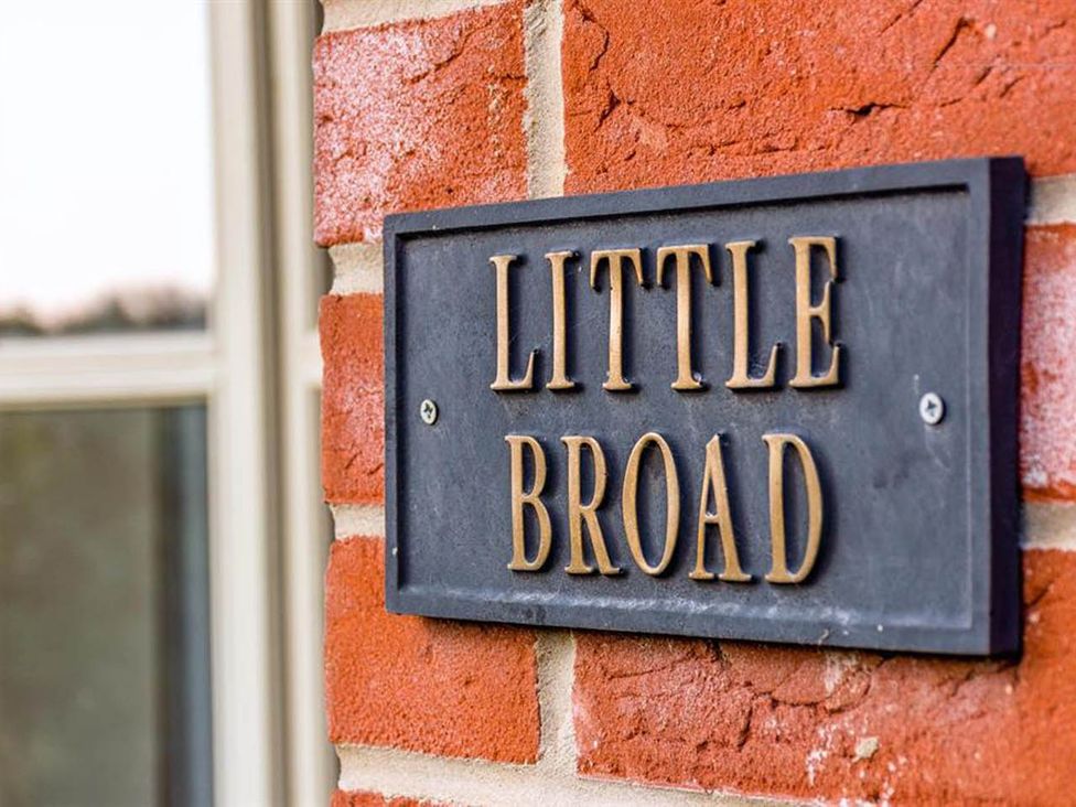 A nameplate on a brick wall at Cottage Sleep 4 Pet Friendly Enclosed Garden in Rollesby, near Scratby