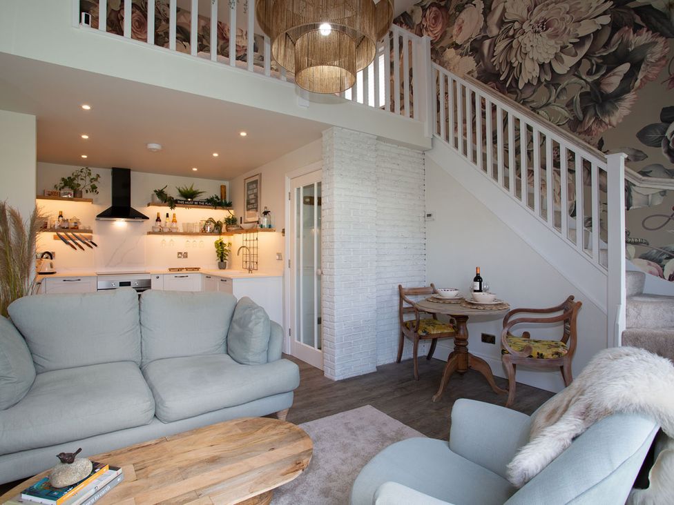A living room with a sofa and coffee table at Cozy Wetherby Retreat in Wetherby