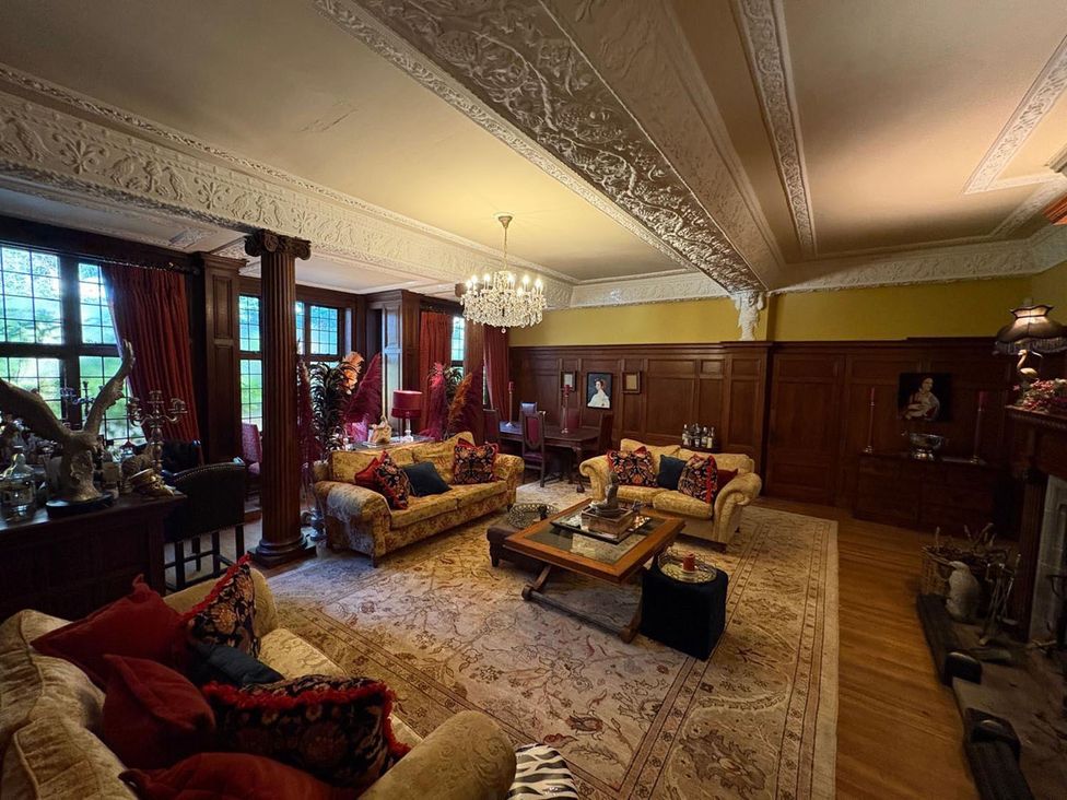 A living room with sofas and a coffee table at The Old Barn in Manchester