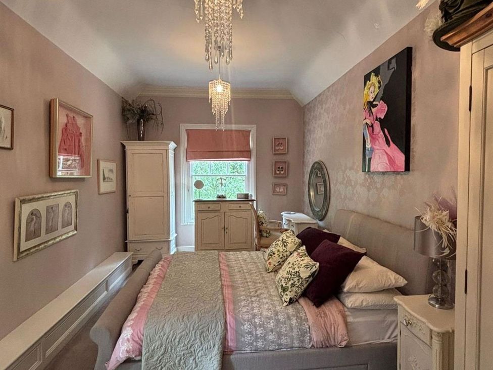 A bedroom with a bed and decorative items at 
