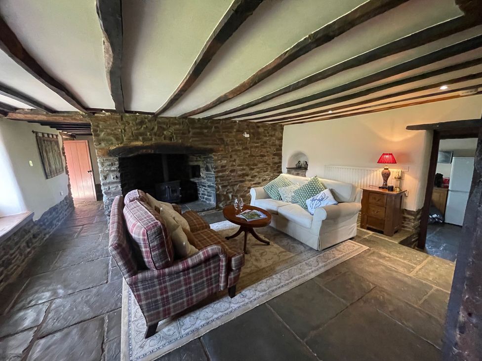 A living room with a sofa and armchair at the property