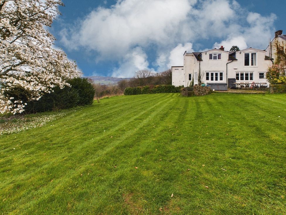 A house with a garden and lawn at Country House 14Guests Parking HotTub AmazingViews in Kilgwrrwg near Chepstow