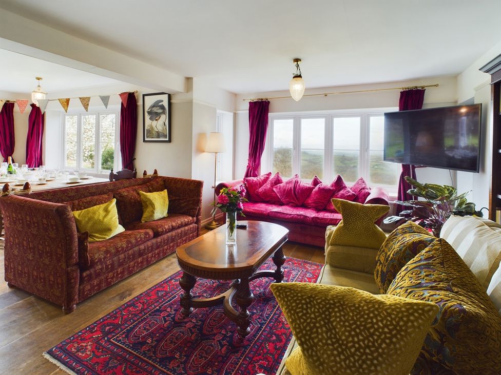 A living room with furniture and a television at Country House 14Guests Parking HotTub AmazingViews Kilgwrrwg near Chepstow