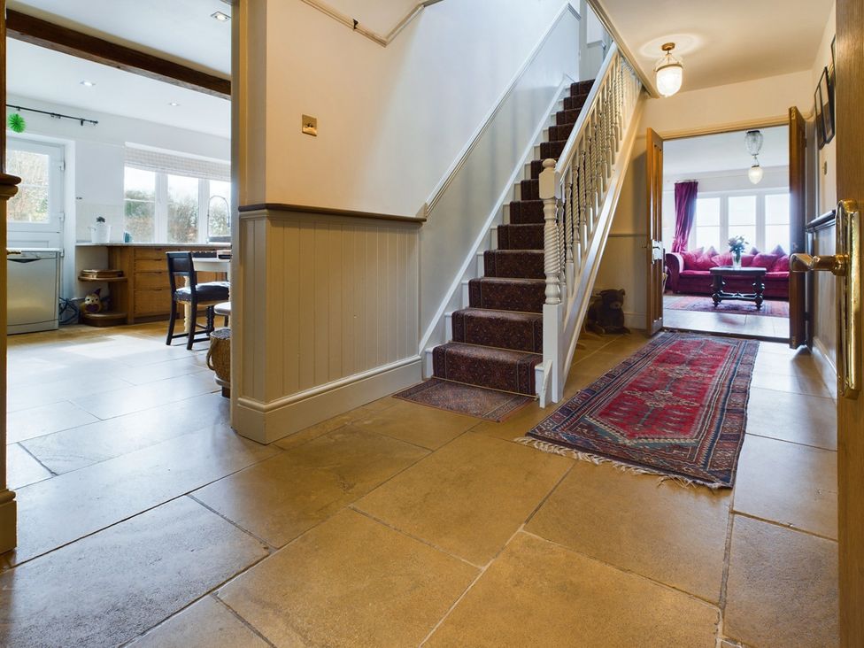 A hallway with stairs and access to a living room at Country House 14Guests Parking HotTub AmazingViews in Kilgwrrwg near Chepstow