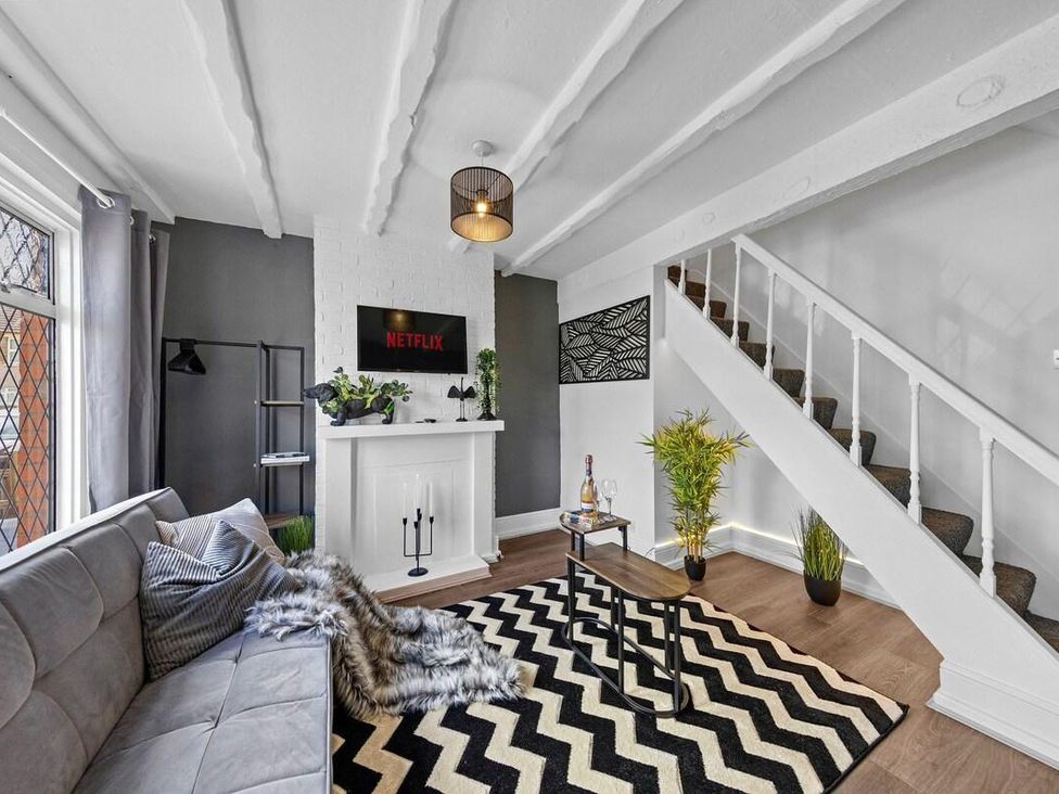A living room with a sofa and coffee table at Apartment Sleeps 7 with Free Parking in Chatham