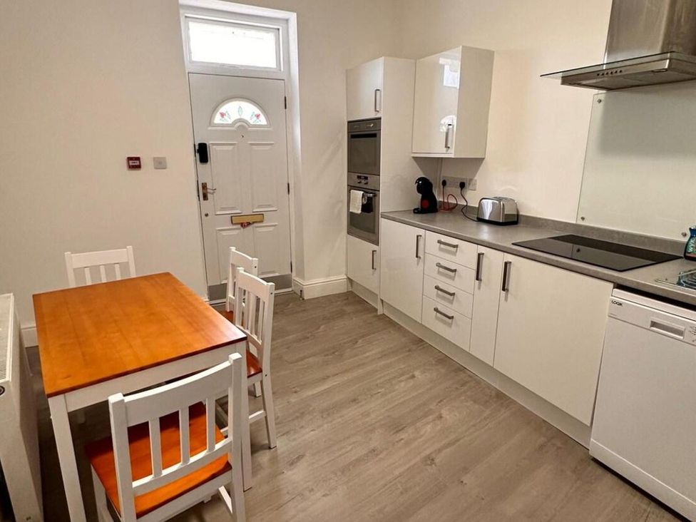 A kitchen with a table and chairs at Near Beach Parking WiFi Sleeps 2 in Lytham St Annes