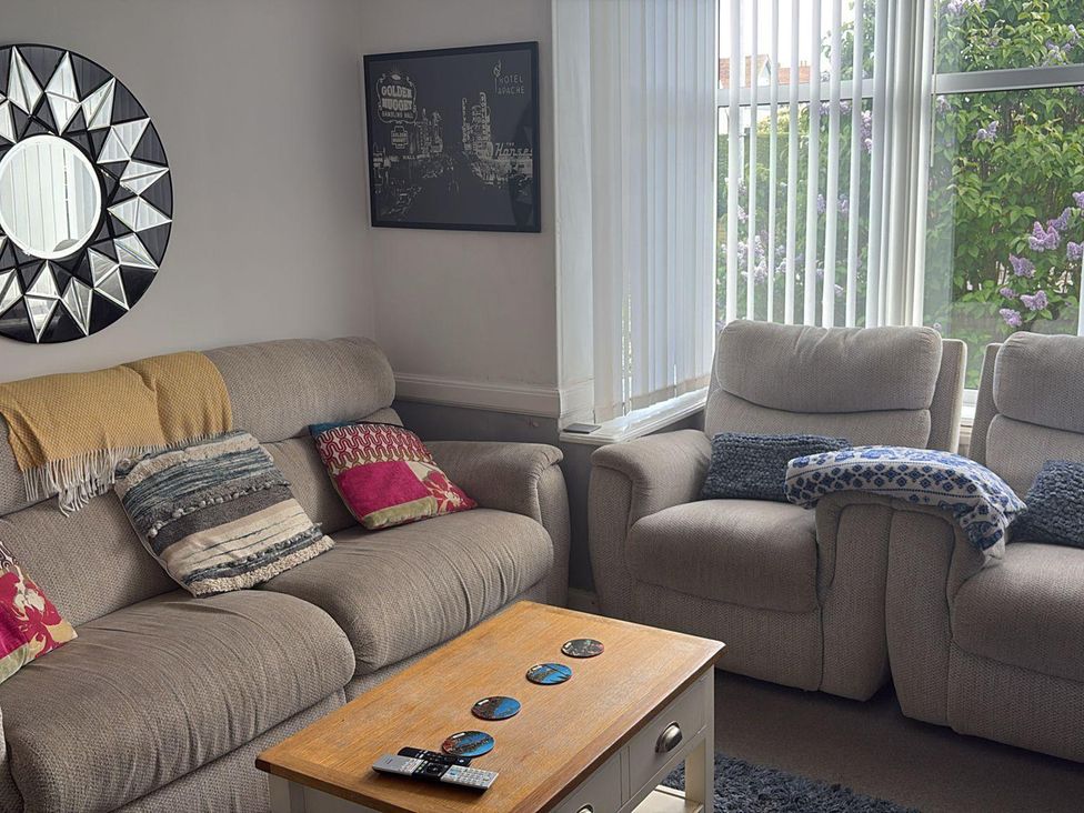 A living room with sofa and armchairs at 5 Bed Villa Sleeps 10 Pets Garden Parking Skegness