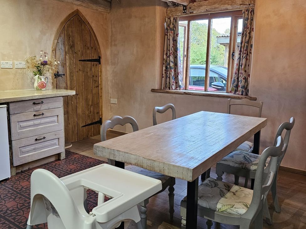 A dining room with a table and chairs at Pet Friendly 3Bed Barn Sleeps 7 Parking Garden, Westhall near Halesworth
