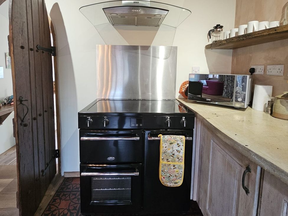 A kitchen with an oven, microwave, and countertop at Pet Friendly 3Bed Barn Sleeps 7 Parking Garden, Westhall near Halesworth