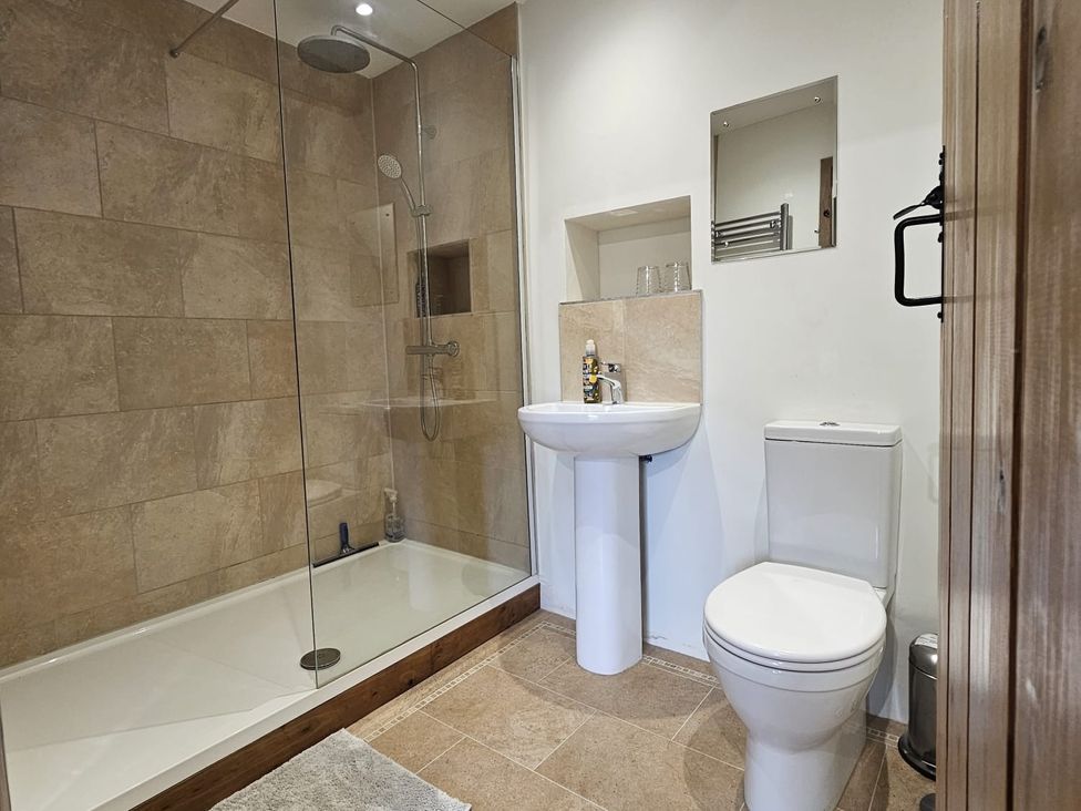 A bathroom with a shower, sink, and toilet at Pet Friendly 3Bed Barn Sleeps 7 Parking Garden in Westhall near Halesworth