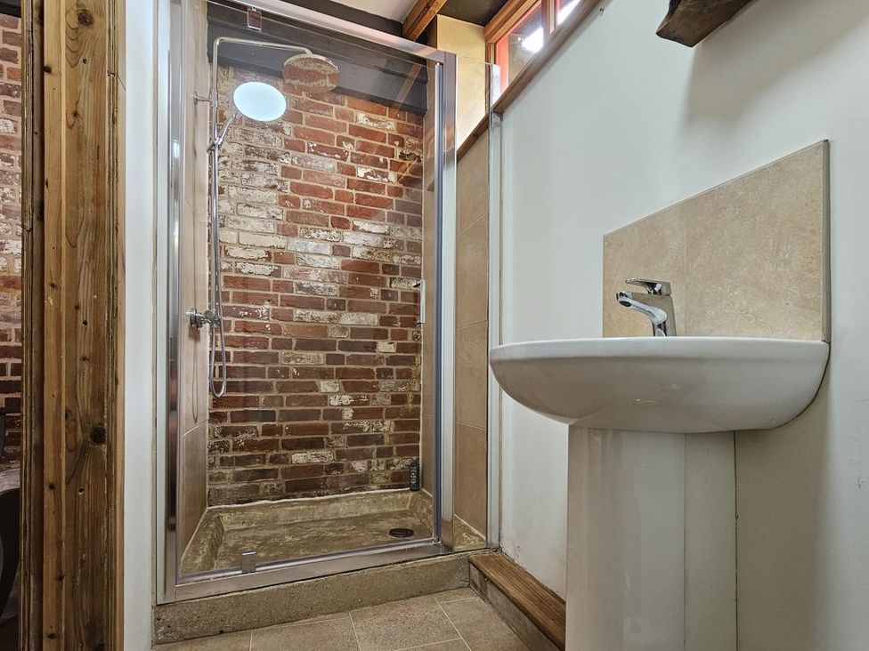 A bathroom with a shower and a sink at Pet Friendly 3Bed Barn Sleeps 7 Parking Garden Westhall near Halesworth